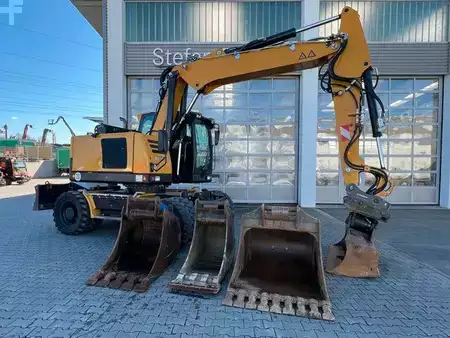 Pelle sur pneus 2022 Hydrema MX14G / OilQuick OQ65 / 4x Löffel / 2.343h /2022 (1)
