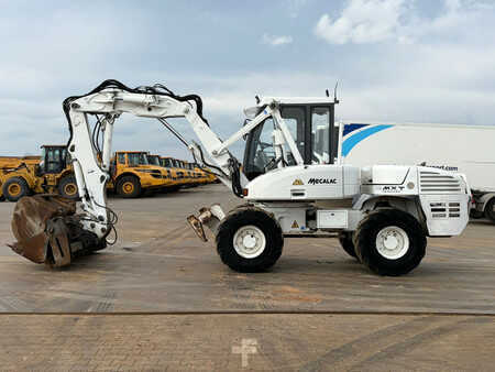 Pelle sur pneus 2013 Mecalac 12MTX incl. 5 x bucket (1)