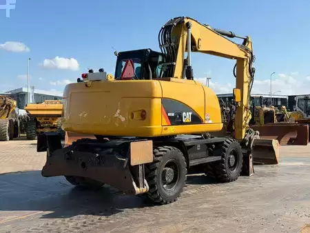 Mobil gravemaskin 2012 Caterpillar M313D VA - Outriggers + Blade (5)
