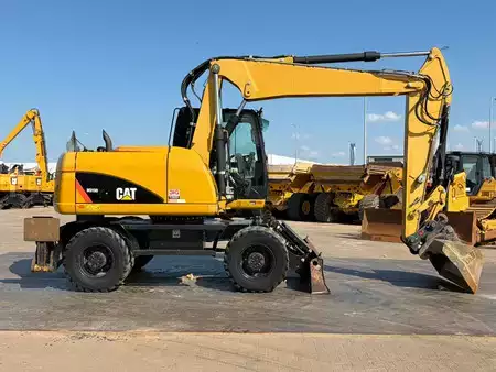 Mobil gravemaskin 2012 Caterpillar M313D VA - Outriggers + Blade (6)