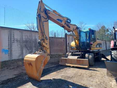 Escavatori gommati 2006 Caterpillar M315C (1)