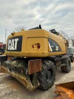 Pelle sur pneus 2014 Caterpillar 313D (1)
