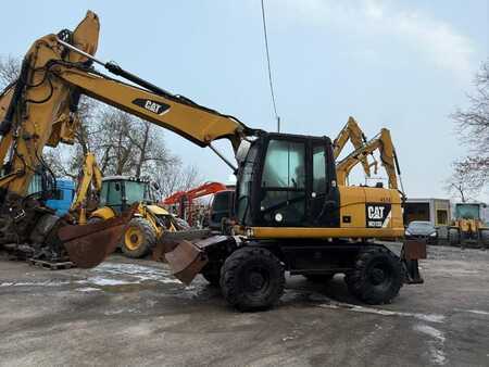Pelle sur pneus 2014 Caterpillar 313D (10)