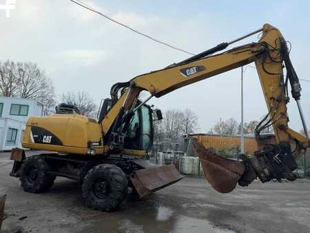Pelle sur pneus 2014 Caterpillar 313D (5)