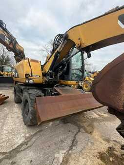 Pelle sur pneus 2014 Caterpillar 313D (8)