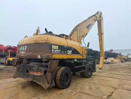 Kuvert Grävare 2005 Caterpillar M 325 C MH (5)