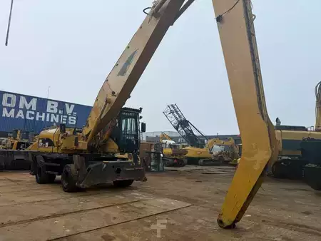 Kuvert Grävare 2005 Caterpillar M 325 C MH (7)