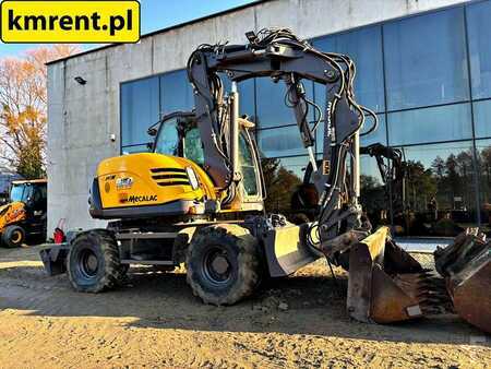 Pelle sur pneus 2010 Mecalac 714 MW (3)