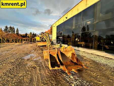 Pelle sur pneus 2005 Caterpillar M313C (10)