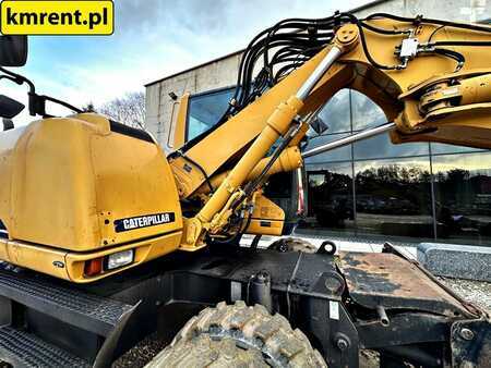 Pelle sur pneus 2005 Caterpillar M313C (16)
