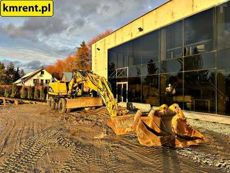 Pelle sur pneus 2005 Caterpillar M313C (2)