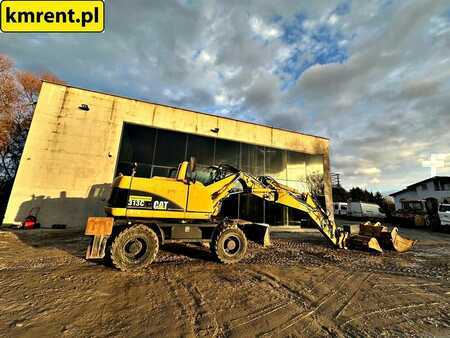 Pelle sur pneus 2005 Caterpillar M313C (3)