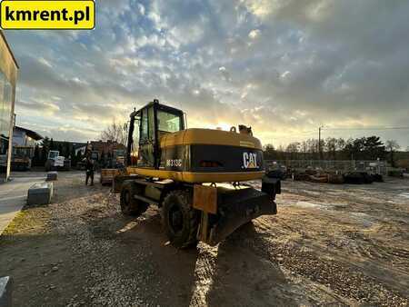 Pelle sur pneus 2005 Caterpillar M313C (6)