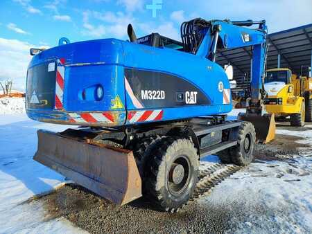 Pelle sur pneus 2010 Caterpillar M322D (4)