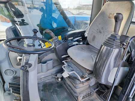 Pelle sur pneus 2010 Caterpillar M322D (5)