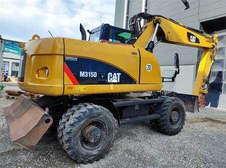 Pelle sur pneus 2009 Caterpillar M315D (4)