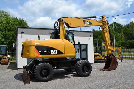Pelle sur pneus 2013 Caterpillar M 316 D (11)