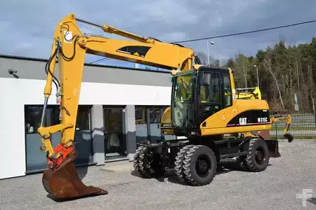 Pelle sur pneus 2006 Caterpillar M 315 C (1)