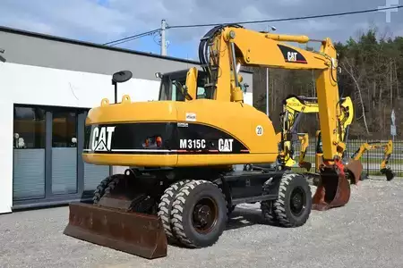 Pelle sur pneus 2006 Caterpillar M 315 C (10)