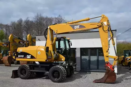 Pelle sur pneus 2006 Caterpillar M 315 C (13)