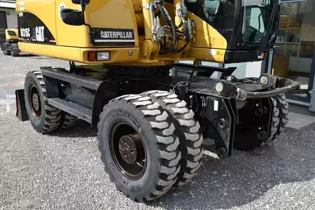 Pelle sur pneus 2006 Caterpillar M 315 C (16)