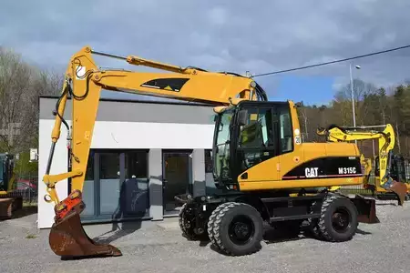 Pelle sur pneus 2006 Caterpillar M 315 C (3)