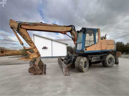 Kerekes kotrógép 1996 Caterpillar M315 (1)