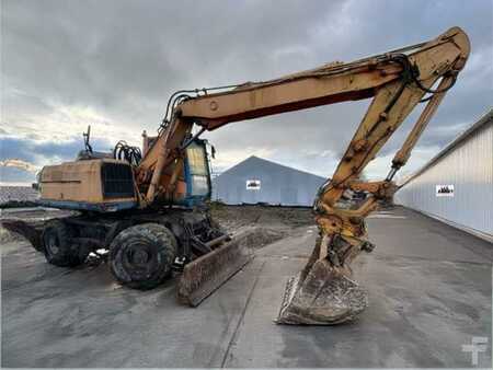 Kerekes kotrógép 1996 Caterpillar M315 (2)