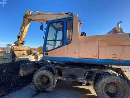 Kerekes kotrógép 1996 Caterpillar M315 (3)