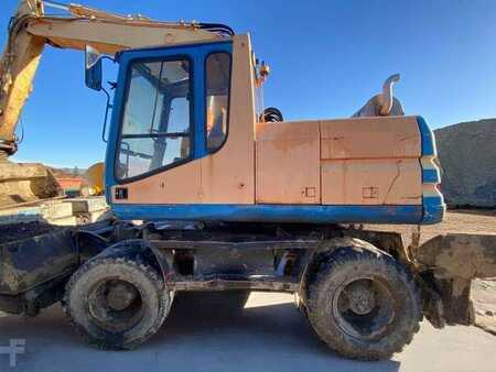 Kerekes kotrógép 1996 Caterpillar M315 (4)