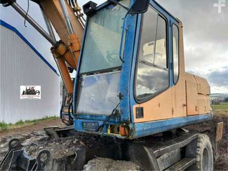 Kerekes kotrógép 1996 Caterpillar M315 (5)