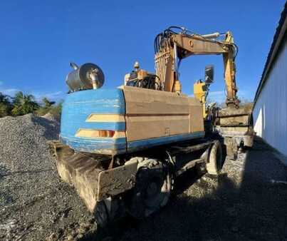 Kerekes kotrógép 1996 Caterpillar M315 (7)