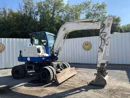 Pelle sur pneus 2014 Doosan DX55W (1)